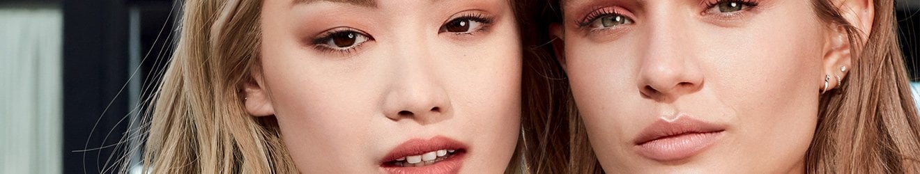 Maybelline Face Makeup products illustrative banner image - Close up of two blond models